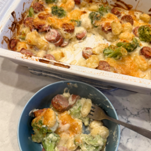 Boursin sausage gnocchi bake with broccoli in a baking dish
