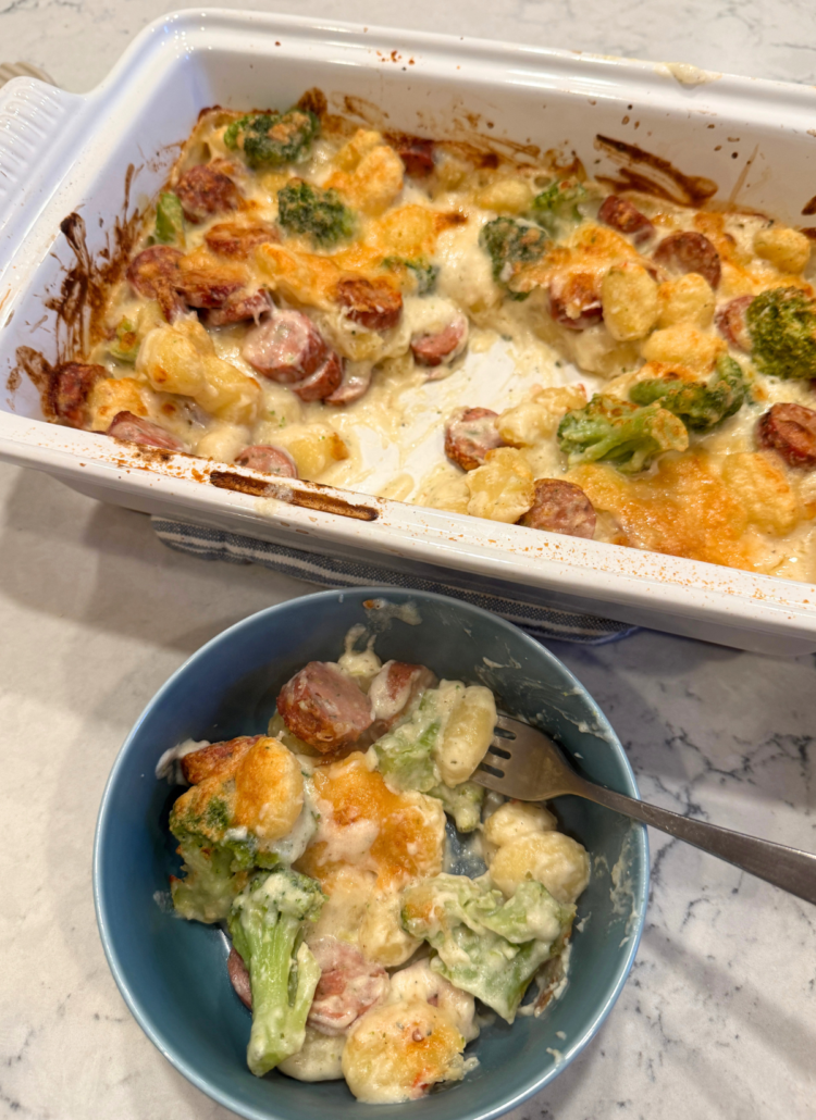 Boursin sausage gnocchi bake with broccoli in a baking dish